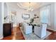 Elegant dining room with large table, stylish chairs and wine storage at 2326 Mountain Ash Way, New Port Richey, FL 34655