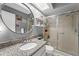 Bathroom featuring vanity, walk-in shower, updated fixtures and bright lighting at 2342 Countryside Dr, Spring Hill, FL 34606