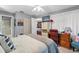 Bright bedroom features a TV, desk, walk-in closet, carpet flooring and access to bathroom at 2342 Countryside Dr, Spring Hill, FL 34606