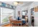 Cheerful breakfast nook with windows and a comfortable seating arrangement at 2342 Countryside Dr, Spring Hill, FL 34606