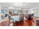 Formal dining room with hardwood floors, decorative chandelier, and seating for six at 2342 Countryside Dr, Spring Hill, FL 34606