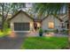 Charming single-story home featuring a well-manicured lawn and an attached two-car garage at 2342 Countryside Dr, Spring Hill, FL 34606