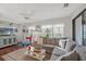 Comfortable living room featuring a plush sectional sofa and lots of natural light at 2342 Countryside Dr, Spring Hill, FL 34606