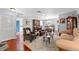 Bright living room with hardwood floors, comfortable seating, and abundant natural light at 2342 Countryside Dr, Spring Hill, FL 34606