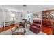 Cozy living room with hardwood floors, comfortable seating, and stylish decor at 2342 Countryside Dr, Spring Hill, FL 34606