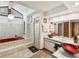 Bathroom featuring a jacuzzi tub, a standing shower, and and vessel sinks at 2404 Knoll Dr, Spring Hill, FL 34608