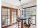 Cozy breakfast nook with a view of the pool through sliding glass doors and large windows at 2404 Knoll Dr, Spring Hill, FL 34608