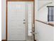 Bright white front door with window and chrome hardware at 2404 Knoll Dr, Spring Hill, FL 34608