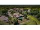 Aerial view of house with pool, pond, golf course, and other community amenities nearby at 2987 Wentworth Way, Tarpon Springs, FL 34688