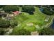 Aerial view of a home located on a golf course and pond at 2987 Wentworth Way, Tarpon Springs, FL 34688