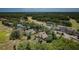 Aerial view of home with pool near the community golf course, country club and lake at 2987 Wentworth Way, Tarpon Springs, FL 34688