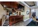 Well-appointed bar area featuring wood cabinetry, ample storage, and a cozy atmosphere at 2987 Wentworth Way, Tarpon Springs, FL 34688