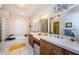 Bathroom featuring a double vanity, tub, and tile flooring at 2987 Wentworth Way, Tarpon Springs, FL 34688