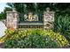 Beautiful stone Wentworth community sign surrounded by lush landscaping and mature trees at 2987 Wentworth Way, Tarpon Springs, FL 34688