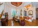 Formal dining room with chandelier, large windows, and access to the entryway at 2987 Wentworth Way, Tarpon Springs, FL 34688