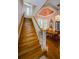 Grand staircase leading to the second floor with dining room visible at 2987 Wentworth Way, Tarpon Springs, FL 34688