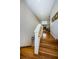 Second floor hallway featuring hardwood floors and a wooden handrail at 2987 Wentworth Way, Tarpon Springs, FL 34688
