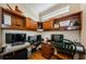 Home office with wood built-in shelving, cabinets, and a corner desk creating a functional workspace at 2987 Wentworth Way, Tarpon Springs, FL 34688