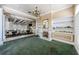 Elegant interior with coffered ceilings, a decorative fireplace, and dining tables set for a special event at 2987 Wentworth Way, Tarpon Springs, FL 34688