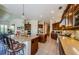 Kitchen with a large island, stainless steel appliances, custom cabinets, and tiled floors at 2987 Wentworth Way, Tarpon Springs, FL 34688