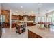 Well-equipped kitchen boasts custom cabinetry, stone countertops, and ample counter space at 2987 Wentworth Way, Tarpon Springs, FL 34688