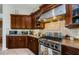 Close up of kitchen with stainless steel appliances, granite countertops, and custom cabinetry at 2987 Wentworth Way, Tarpon Springs, FL 34688