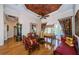 Spacious living room featuring unique decor, decorative ceilings, hardwood floors, and a ceiling fan at 2987 Wentworth Way, Tarpon Springs, FL 34688