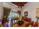 Bright living room with hardwood floors, decorative ceilings, unique furnishings, and natural light at 2987 Wentworth Way, Tarpon Springs, FL 34688