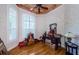 Bright living room with hardwood floors, plantation shutters, and tray ceiling at 2987 Wentworth Way, Tarpon Springs, FL 34688