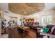 A spacious living area with leather furniture, hardwood floors, and designer touches at 2987 Wentworth Way, Tarpon Springs, FL 34688