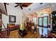 Open concept living room features hardwood floors, unique furniture, and decorative ceilings at 2987 Wentworth Way, Tarpon Springs, FL 34688