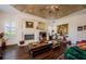 Living room area features fireplace and hardwood floors at 2987 Wentworth Way, Tarpon Springs, FL 34688
