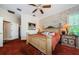 Bedroom features a traditional bed, ceiling fan and large window at 2987 Wentworth Way, Tarpon Springs, FL 34688