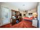 Primary bedroom with shutters, ceiling fan, and built-in shelves at 2987 Wentworth Way, Tarpon Springs, FL 34688