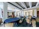 Spacious meeting room with abundant seating, elegant chandeliers, and classic design at 2987 Wentworth Way, Tarpon Springs, FL 34688