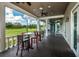 Scenic outdoor seating area overlooking a lush golf course at 2987 Wentworth Way, Tarpon Springs, FL 34688