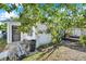 Image shows view of the backyard with screened in porch at 3118 Lloyd Dr, Holiday, FL 34691