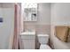 Functional bathroom with a walk-in shower, a toilet, and a single-sink vanity with essential amenities at 3118 Lloyd Dr, Holiday, FL 34691