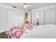 Charming bedroom showcasing built-in storage and a cozy ceiling fan at 3118 Lloyd Dr, Holiday, FL 34691