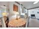 Dining area with a floral tablecloth and a view into the living room and kitchen at 3118 Lloyd Dr, Holiday, FL 34691