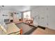 Bright living room with a futon, cabinet, chair, and natural light from the window at 3118 Lloyd Dr, Holiday, FL 34691