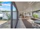 Image shows the screened porch and attached outdoor bar at 3118 Lloyd Dr, Holiday, FL 34691