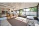 Relaxing screened-in porch with an outdoor bar and access to the yard for versatile living at 3118 Lloyd Dr, Holiday, FL 34691