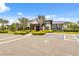 Modern clubhouse exterior with clean lines, landscaping, and parking, offering a welcoming gathering space for residents at 33466 Landsman Loop, Wesley Chapel, FL 33543