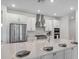 Modern kitchen with stainless steel appliances, gas range, granite countertops and large island at 33466 Landsman Loop, Wesley Chapel, FL 33543
