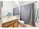 Bathroom with tub and shower, a wooden vanity and a large mirror at 4015 Angel Oak Ct # 201, Tampa, FL 33613