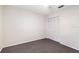 Bedroom with gray carpet, ceiling fan, and a double-door closet at 4015 Angel Oak Ct # 201, Tampa, FL 33613