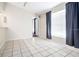 Dining area featuring tile floors, a window with curtains, and a partial view of the kitchen at 4015 Angel Oak Ct # 201, Tampa, FL 33613