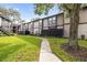 Attractive condo building with well-maintained landscaping and inviting walkway at 4015 Angel Oak Ct # 201, Tampa, FL 33613