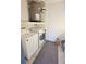 Laundry room with washing machine, dryer and a water heater at 4015 Angel Oak Ct # 201, Tampa, FL 33613